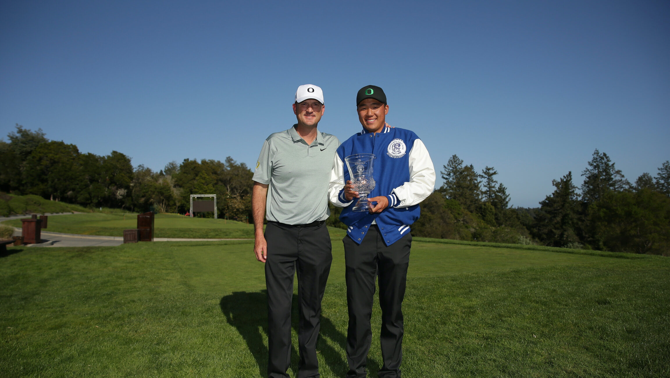 Coach Casey Martin with Individual Champion Norman Xiong, Oregon