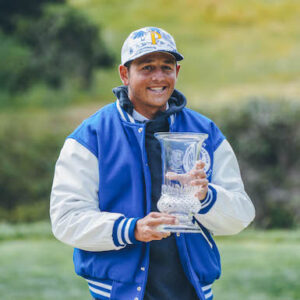 photo of 2022 individual champion, Dylan Menante of Pepperdine with trophy and Blue Jacket