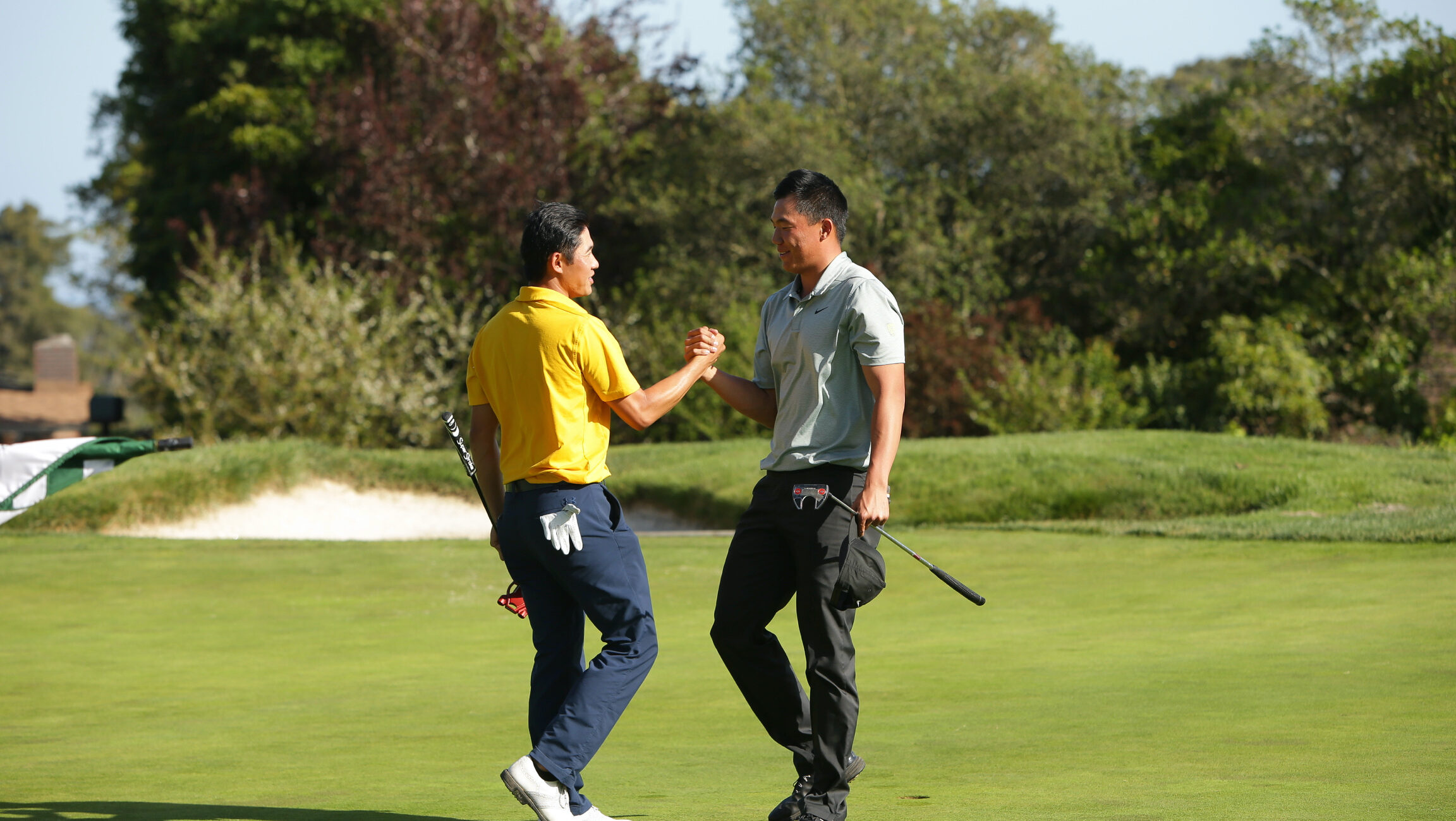 Cal's Collin Morikawa congratulates Oregon's Norman Xiong for winning the 3-player playoff